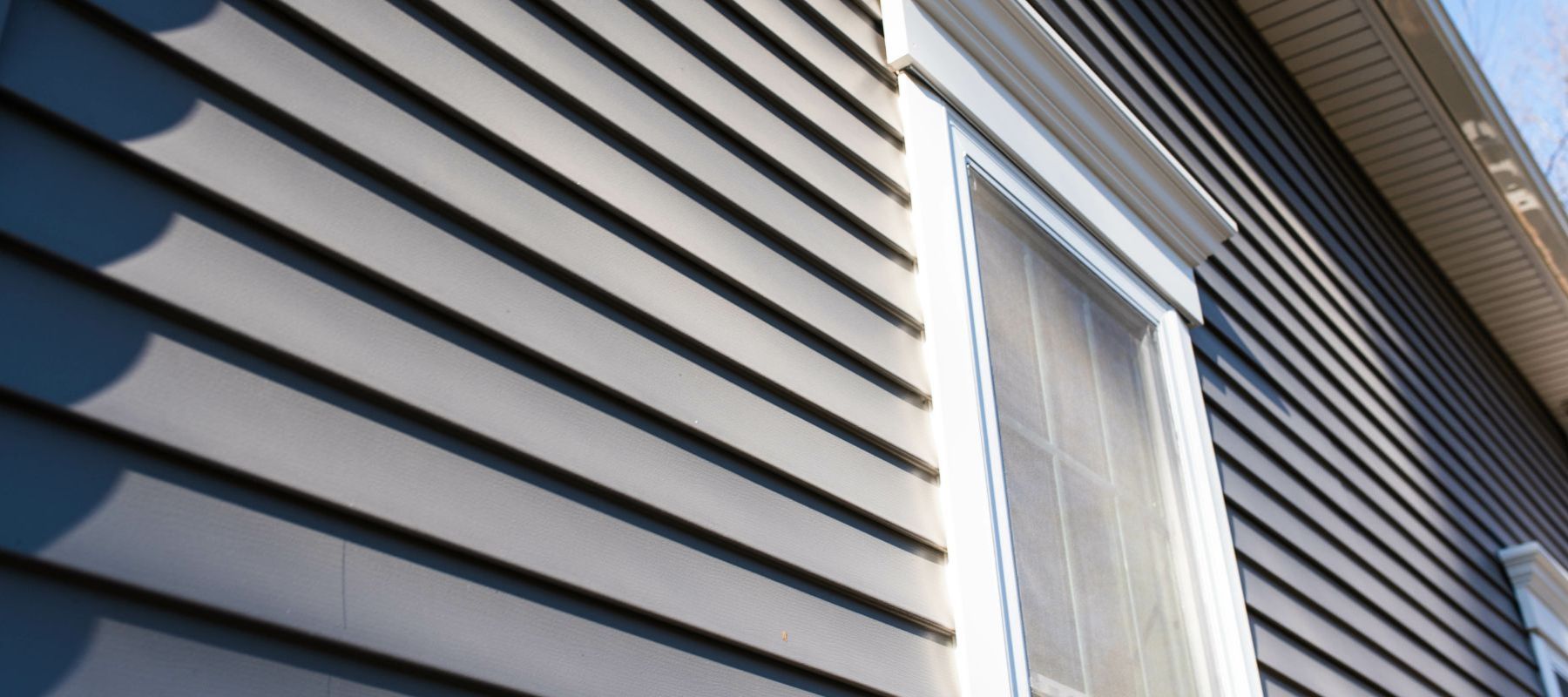 Contractor installing fiber cement siding on a home in North Palm Beach Florida