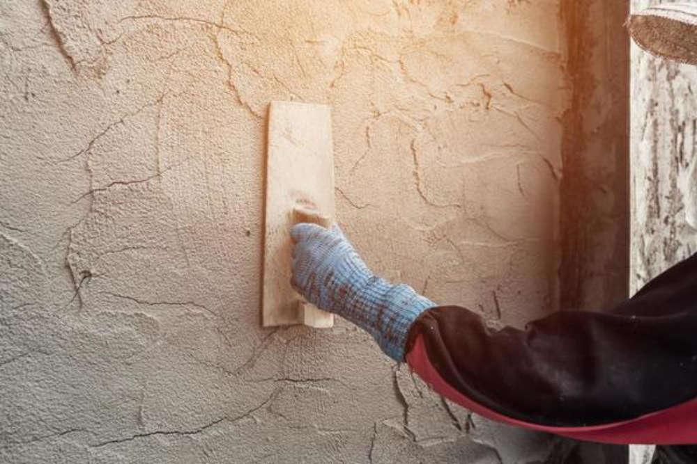 K-Boys Construction team applying stucco to a home exterior in Jupiter Florida